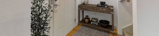 the entrance to a bathroom with a white door and a plant