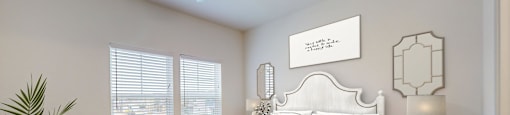 a bedroom with a bed and a ceiling fan