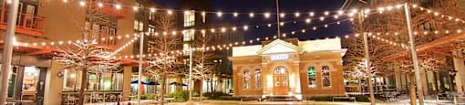 Evening View of Pearl Parkito Located in Front of Cured at The Can Plant Residences at Pearl, San Antonio, Texas