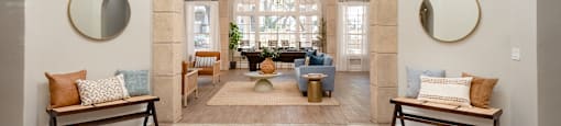 a living room with an arched ceiling and a lobby with seating and a table  at Hayden on West Ave, San Antonio, 78216