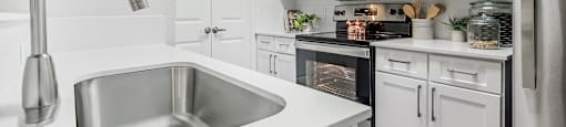 our spacious kitchen is equipped with stainless steel appliances and white cabinets  at Hayden on West Ave, San Antonio, 78216