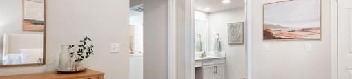 a bedroom with a bed and a dresser and a bathroom  at Hayden on West Ave, San Antonio, TX
