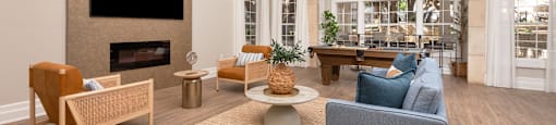 a living room with a fireplace and a table with chairs  at Hayden on West Ave, San Antonio