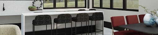 A modern dining room with a white table and chairs.