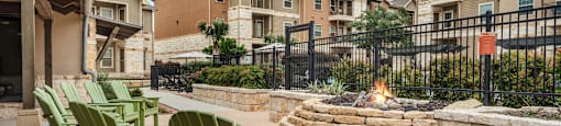 chairs and fire pit at the preserve at green valley apartments