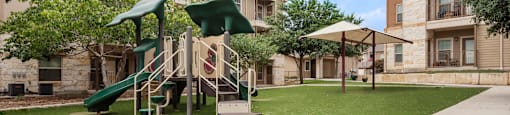 our apartments have a play area with a slide and grass