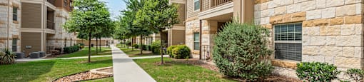 the preserve at ballantyne commons walkway between apartment buildings
