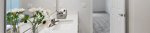 a bathroom with a large mirror and a white door  at Hayden on West Ave, San Antonio, TX