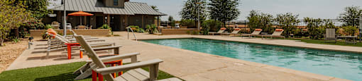take a dip in the pool at the whispering winds apartments in pearland, tx