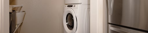 a washer and dryer in a small laundry room