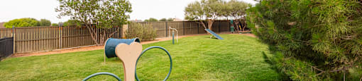 a playground with a seesaw and monkey bars