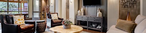 a living room filled with furniture and a flat screen tv
