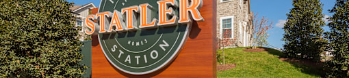a sign in front of a building with the statler logo on it