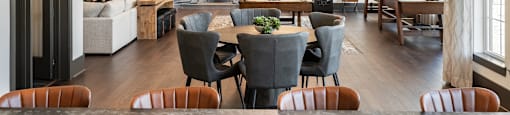 a dining room and living room with a table and chairs