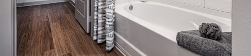 a bathroom with a tub and shower and a shower curtain