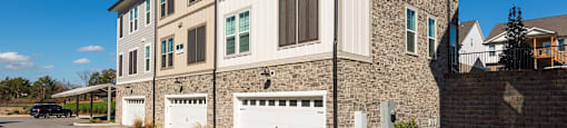 a large house with a white garage door in front of it