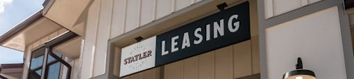 a leasing sign on the side of a building