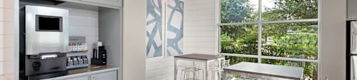 a kitchen with a table and chairs next to a window