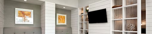 a room with a table and chairs and a television on the wall