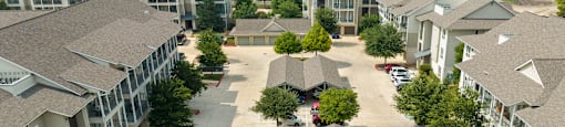 an aerial view of a large neighborhood with several rows of houses