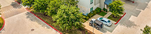an aerial view of the leasing office at the enclave at woodbridge apartments in sugar land,
