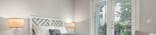 a bedroom with a bed and a chair