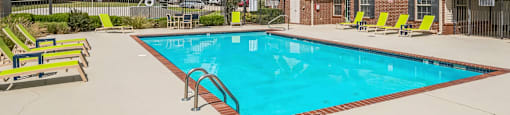 our apartments have a resort style pool with lounge chairs