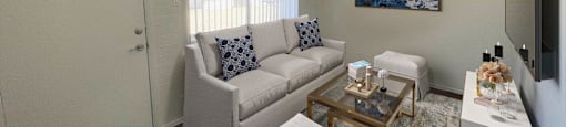 a living room with white couches and a coffee table
