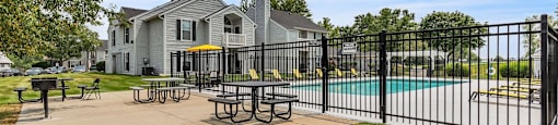 our apartments have a pool and a patio with tables