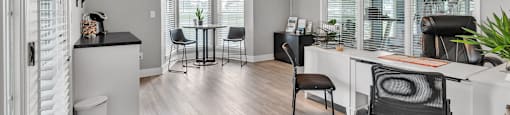 an open living room with a dining room and a kitchen
