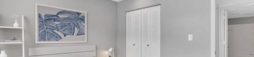 a bedroom with a bed and a closet