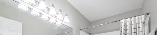 a bathroom with a sink and a toilet and a shower