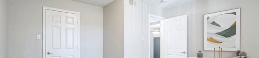a bedroom with a large bed and a closet