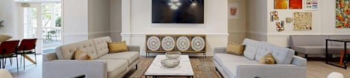 A living room with a grey sofa and a coffee table.
