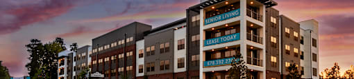 a rendering of an apartment building at sunset