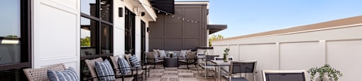 a rendering of a patio with tables and chairs