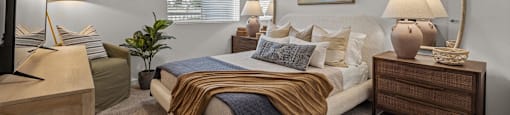 a bedroom with a bed and a ceiling fanat Westbury Apartments, Rancho Cucamonga, 91739