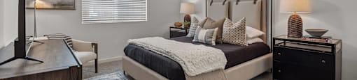a bedroom with a bed and a ceiling fanat Westbury Apartments, Rancho Cucamonga, California