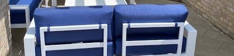 a group of blue and white chairs on a patioat Westbury Apartments, Rancho Cucamonga