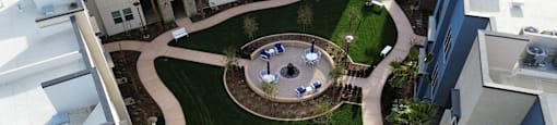 an aerial view of the courtyard of an apartment building with a lawn  at Westbury Apartments, Rancho Cucamonga, 91739