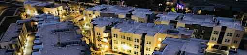 a city at night with buildings and a fountainat Westbury Apartments, Rancho Cucamonga, CA, 91739