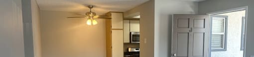 an empty living room and kitchen with a ceiling fanat Lincoln Park Apartments, California