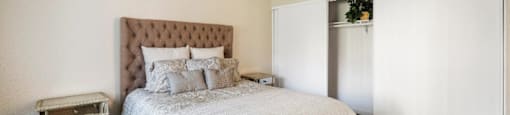 Bedroom With Closet at The Oaks Apartments, Upland, California