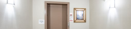 a room with a door to a closet and a carpeted floor