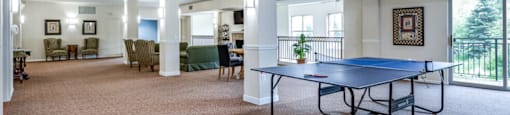 a game room with a ping pong table