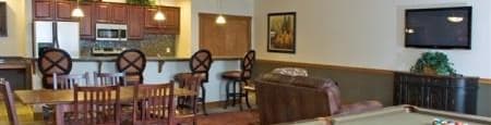 community room with a pool table and a television