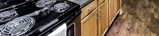 Kitchens with stainless steel appliances at The Larimore Apartments, Omaha, NE 68164