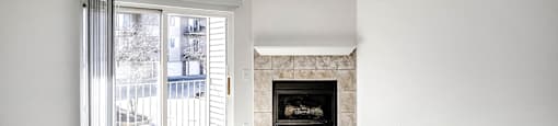 Living Room with natural lighting and fireplace at Deer Park Apartments in Council Bluffs, IA