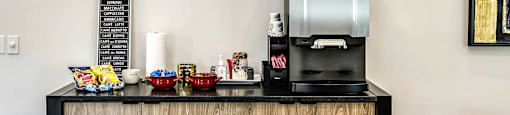 Clubhouse with coffee bar with a coffeemaker  at Legacy Commons Apartments in Omaha, NE