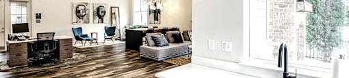Spacious clubhouse with wood plank flooring at Legacy Commons Apartments in Omaha, NE
